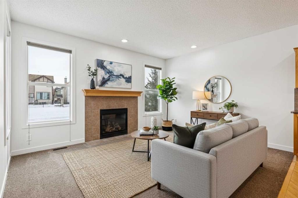 174 Brightonstone Landing Se, Calgary, AB - Indoor Photo Showing Living Room With Fireplace