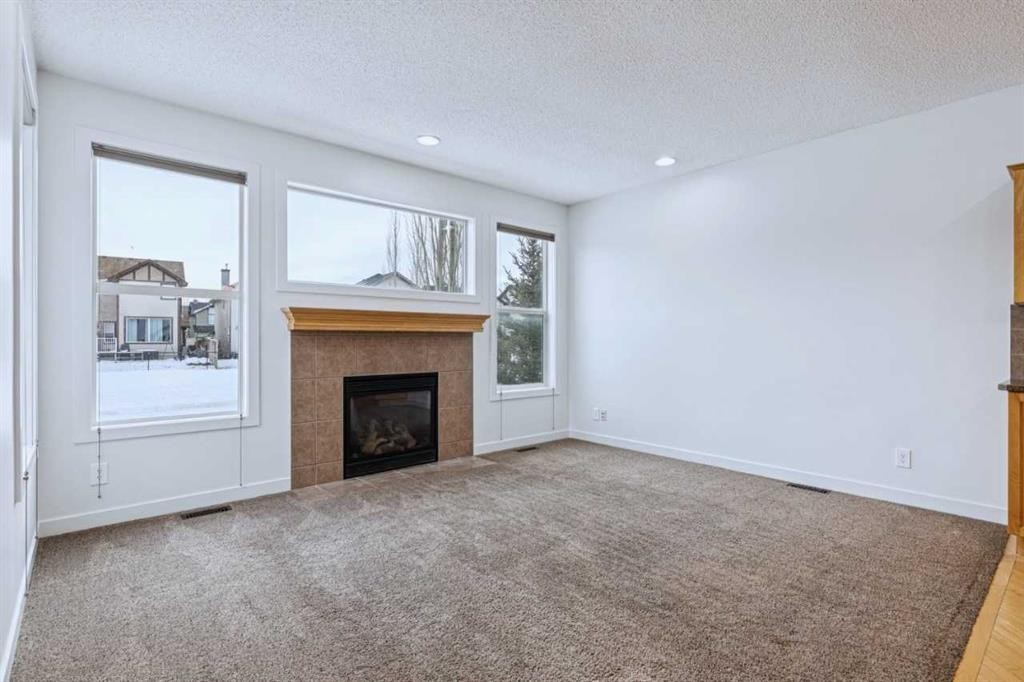 174 Brightonstone Landing Se, Calgary, AB - Indoor Photo Showing Living Room With Fireplace