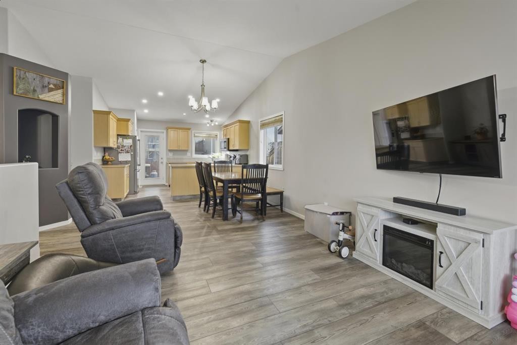 30 Fulmar Close, Sylvan Lake, AB - Indoor Photo Showing Living Room With Fireplace