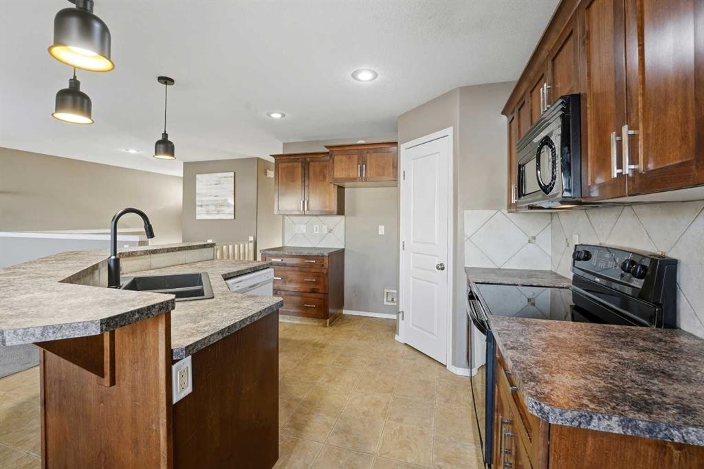 36 Ibbotson Close, Red Deer, AB - Indoor Photo Showing Kitchen With Double Sink