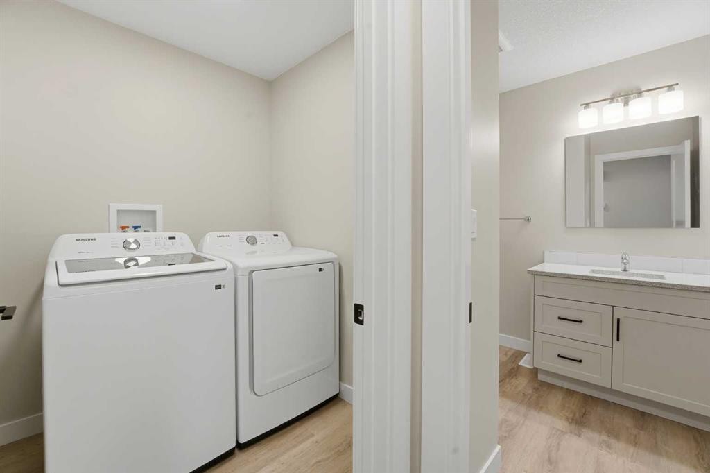 82 Bruns Crescent, Lacombe, AB - Indoor Photo Showing Laundry Room