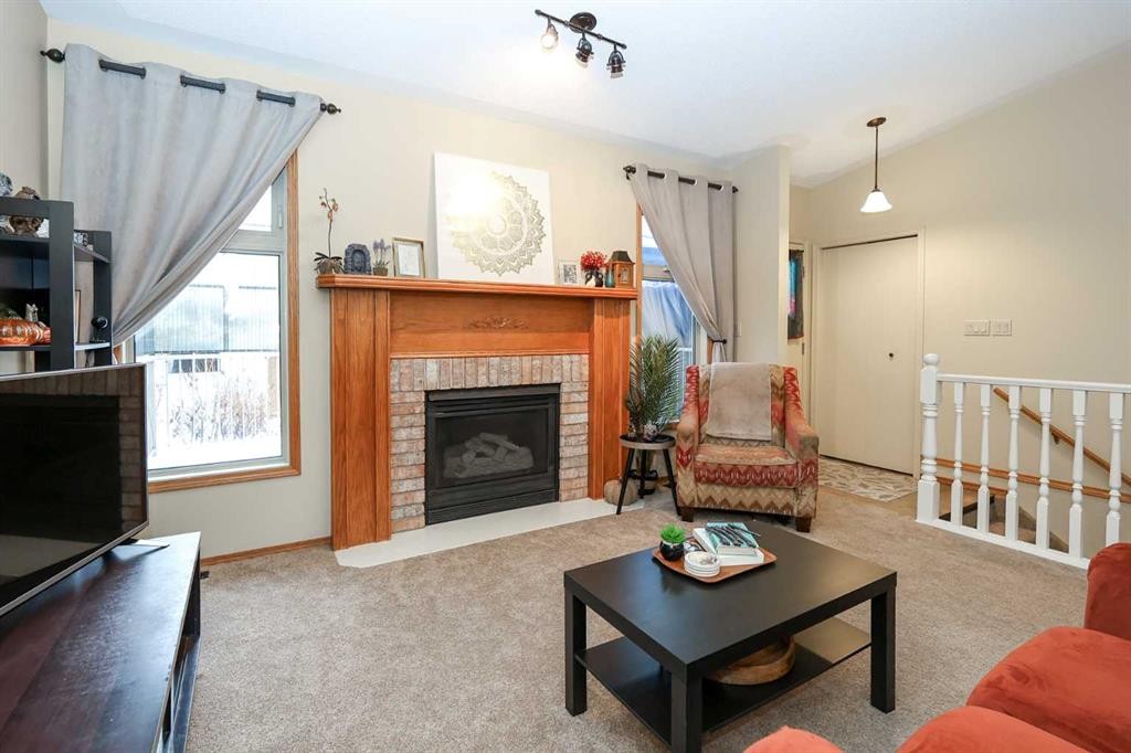 31 Armitage Close, Red Deer, AB - Indoor Photo Showing Living Room With Fireplace