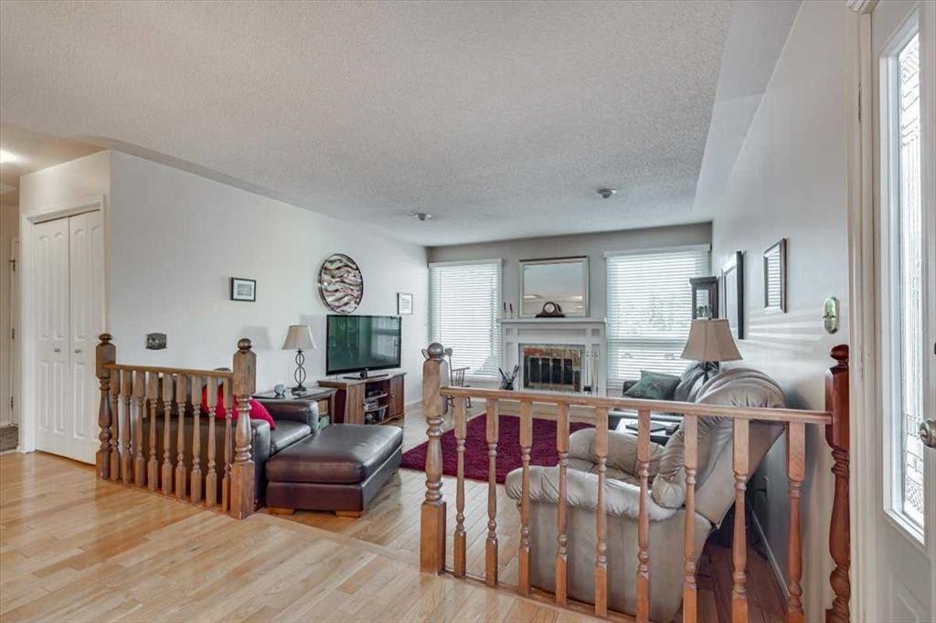 40 Nielsen Close, Red Deer, AB - Indoor Photo Showing Living Room With Fireplace