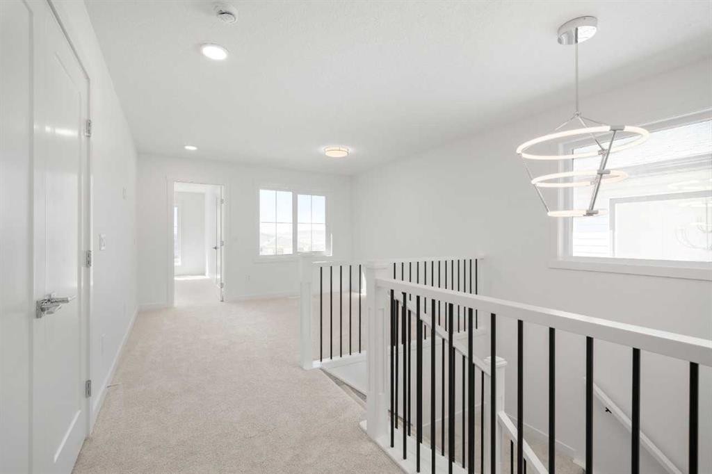 87 Heritage Manor, Cochrane, AB - Indoor Photo Showing Other Room