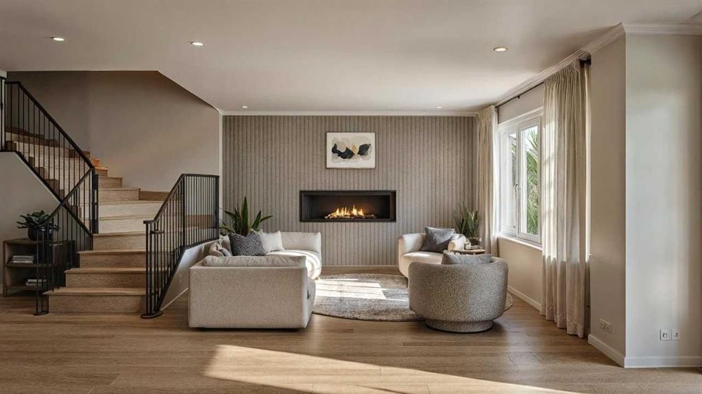 87 Heritage Manor, Cochrane, AB - Indoor Photo Showing Other Room With Fireplace