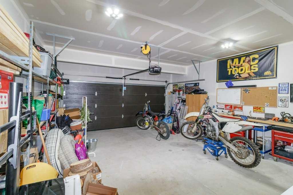 16 Trinity Street, Lacombe, AB - Indoor Photo Showing Garage