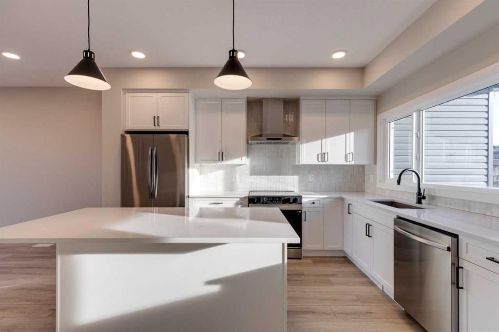 315 Fireside Drive, Cochrane, AB - Indoor Photo Showing Kitchen With Upgraded Kitchen