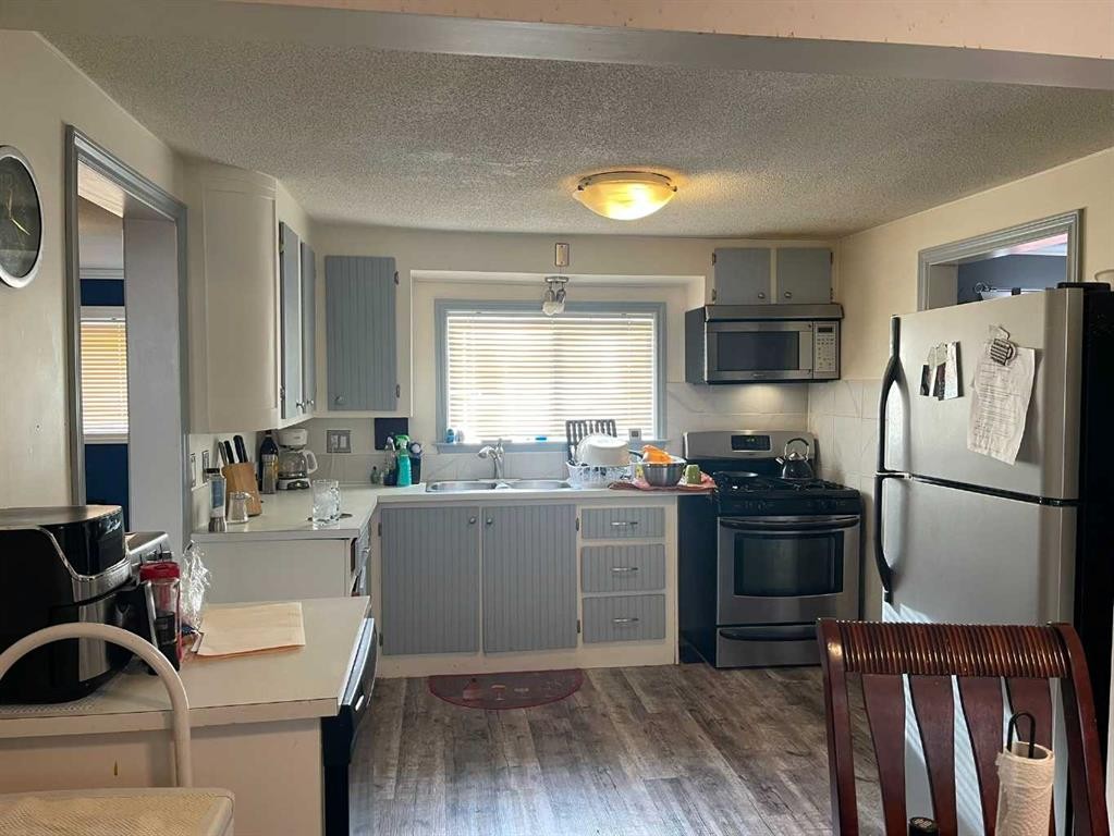 3629 51 Avenue, Red Deer, AB - Indoor Photo Showing Kitchen With Double Sink