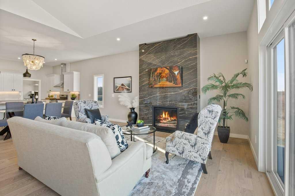 10 Twin Rose Court, Jarvis Bay, AB - Indoor Photo Showing Living Room With Fireplace