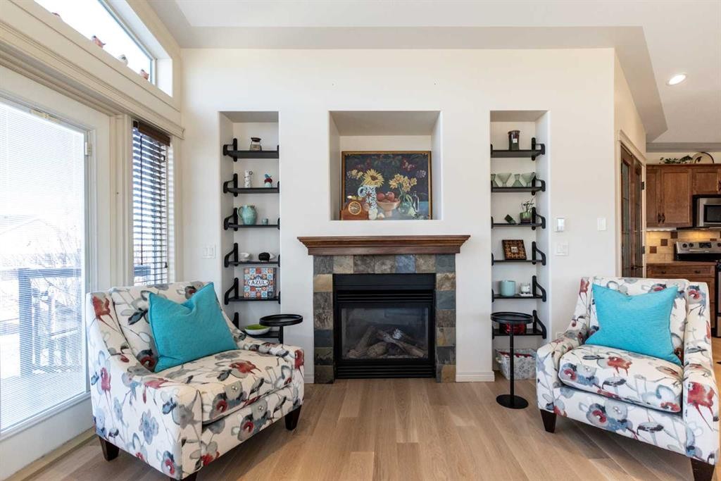 6371 Cedar Way, Innisfail, AB - Indoor Photo Showing Living Room With Fireplace