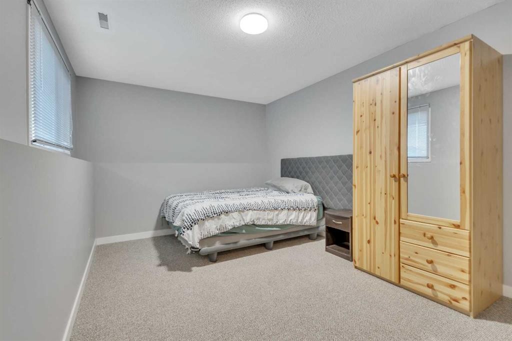 216-48 Holmes, Red Deer, AB - Indoor Photo Showing Bedroom
