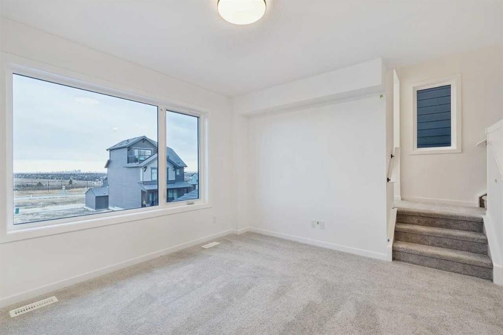 28 Bluerock Terrace Sw, Calgary, AB - Indoor Photo Showing Other Room