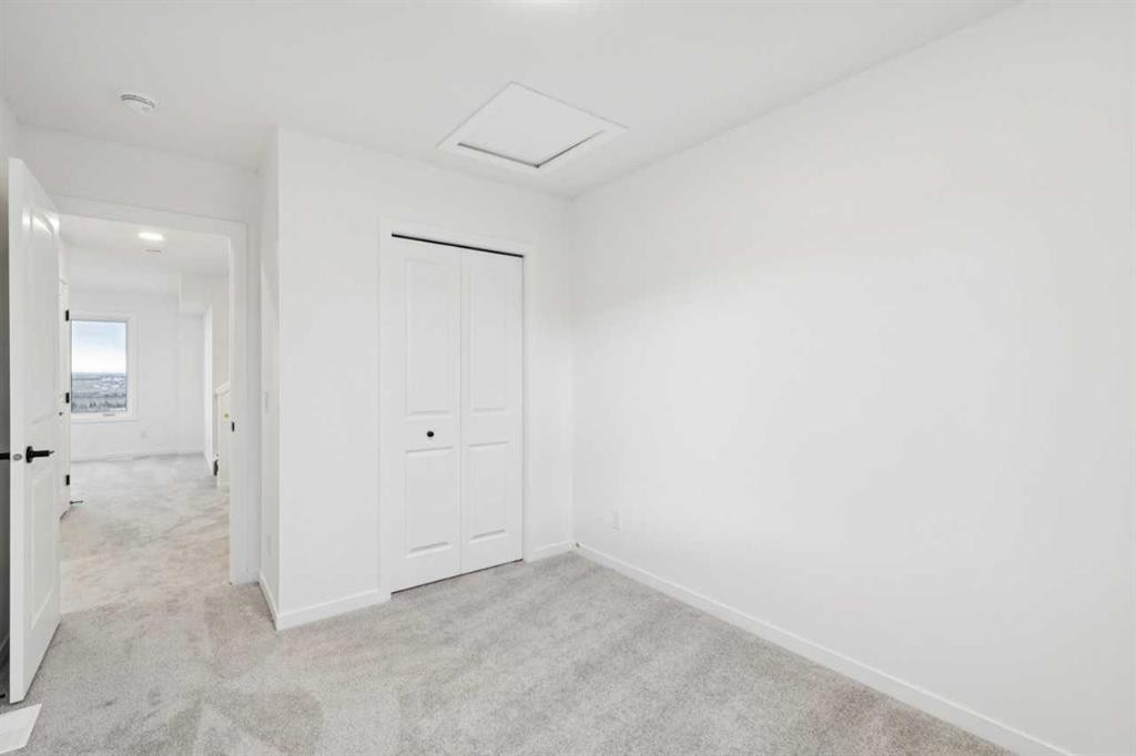 28 Bluerock Terrace Sw, Calgary, AB - Indoor Photo Showing Other Room