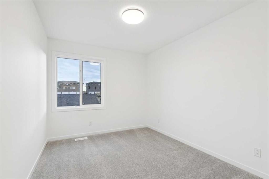 28 Bluerock Terrace Sw, Calgary, AB - Indoor Photo Showing Other Room