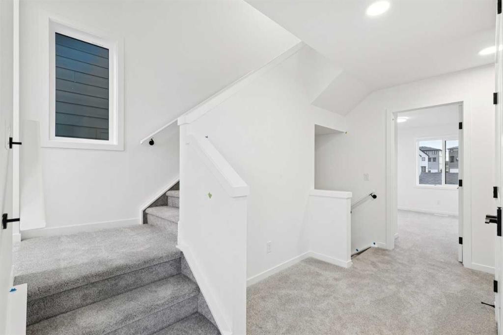28 Bluerock Terrace Sw, Calgary, AB - Indoor Photo Showing Other Room