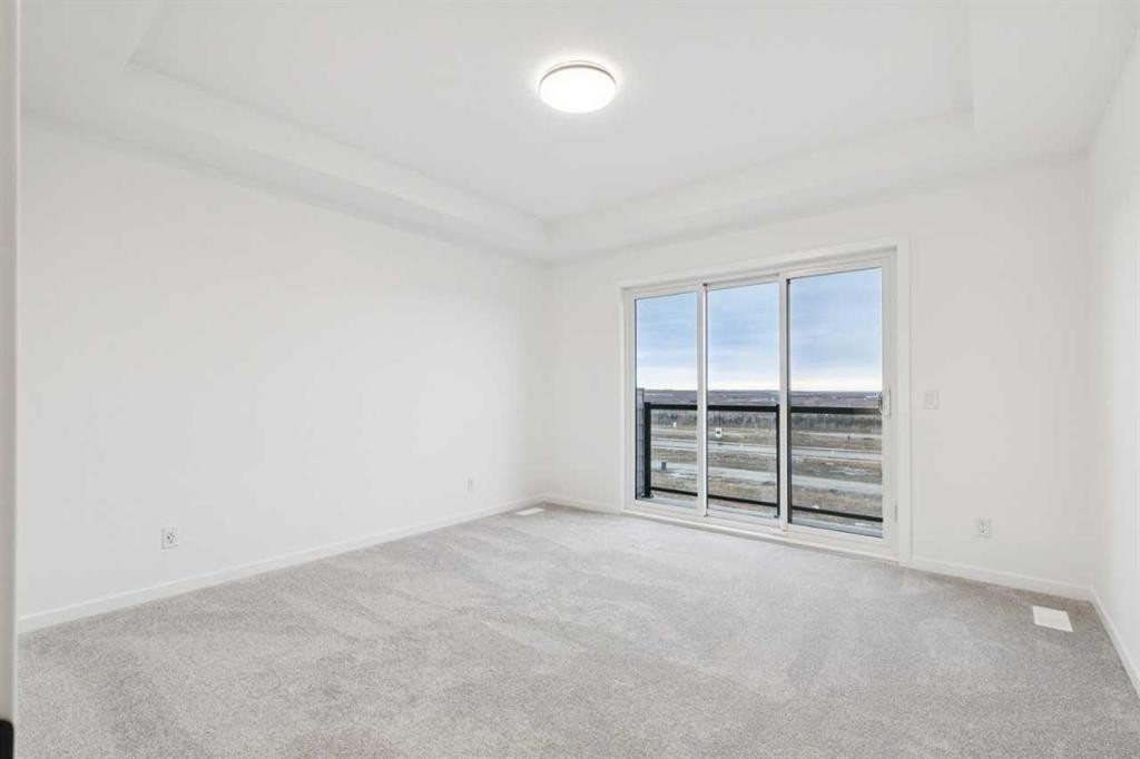 28 Bluerock Terrace Sw, Calgary, AB - Indoor Photo Showing Other Room