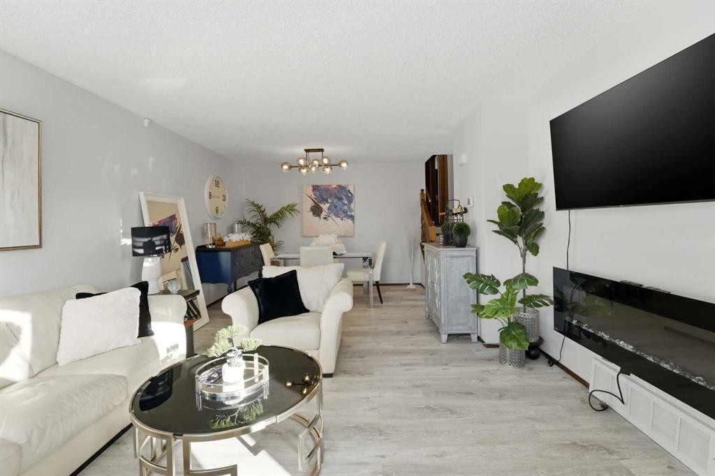 101 Erickson Drive, Red Deer, AB - Indoor Photo Showing Living Room With Fireplace