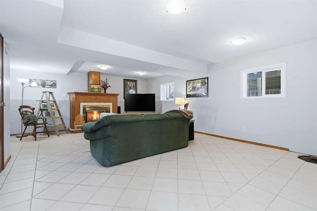 39081 C&E Trail, Red Deer, AB - Indoor With Fireplace