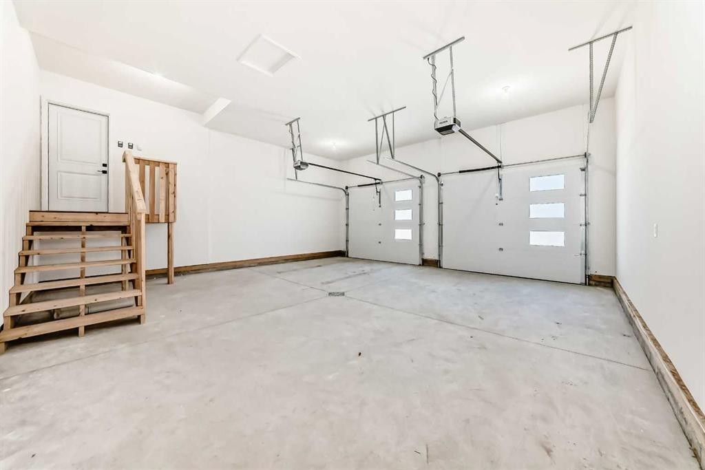 58 Mitchell Crescent, Blackfalds, AB - Indoor Photo Showing Garage