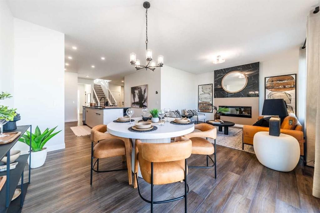 405 Sora Way Se, Calgary, AB - Indoor Photo Showing Dining Room With Fireplace