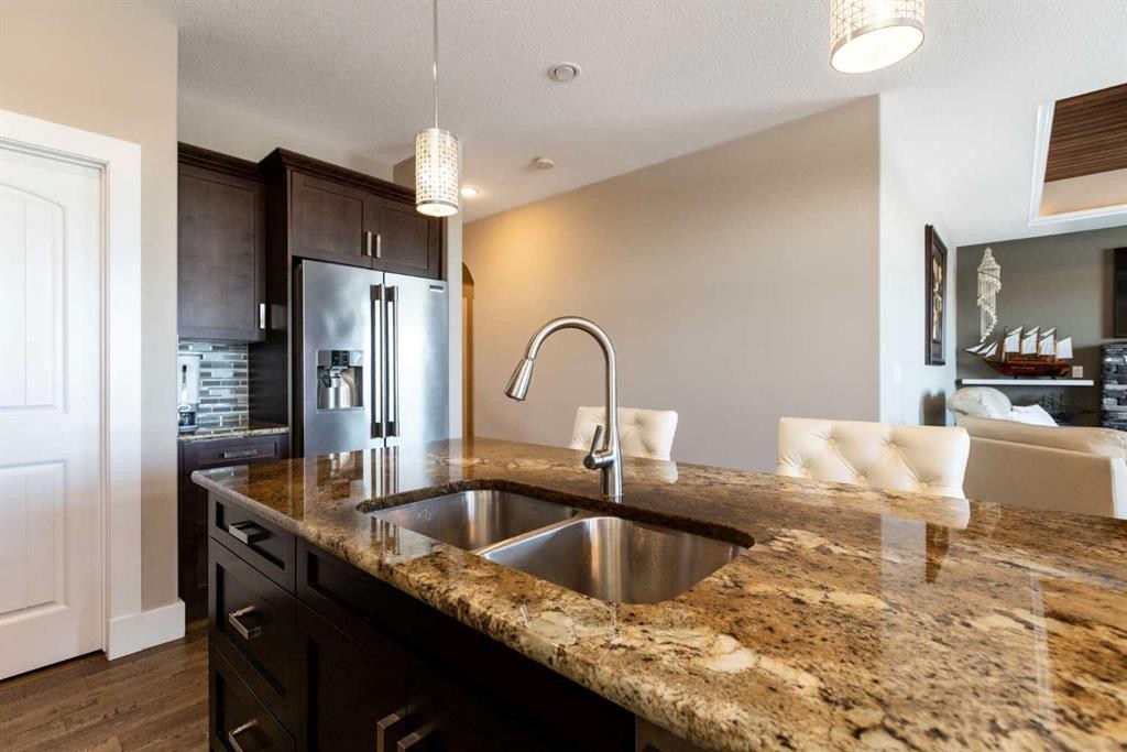 5824 Maple Crescent, Innisfail, AB - Indoor Photo Showing Kitchen With Double Sink