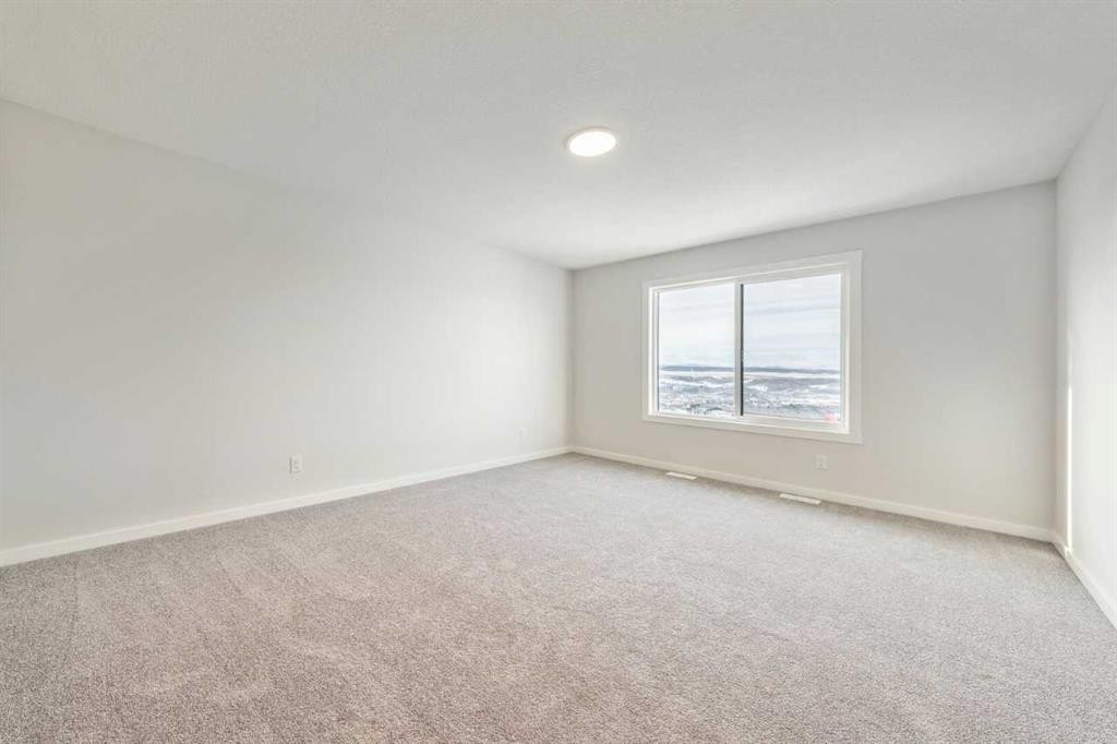 24 Heritage Link, Cochrane, AB - Indoor Photo Showing Other Room