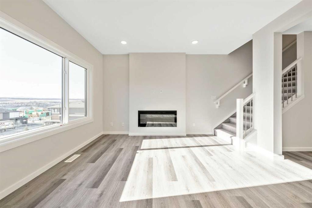 358 Heritage Boulevard, Cochrane, AB - Indoor With Fireplace