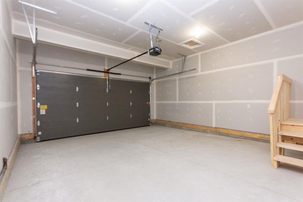 17 Trinity Street, Lacombe, AB - Indoor Photo Showing Garage