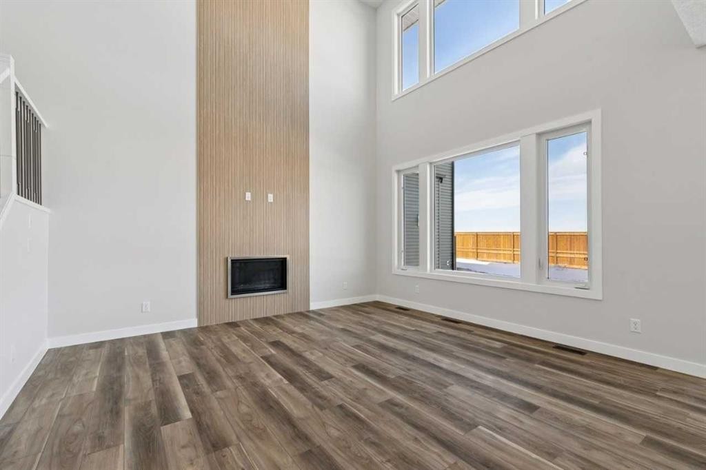 420 Bridgeport Glen, Chestermere, AB - Indoor Photo Showing Other Room With Fireplace