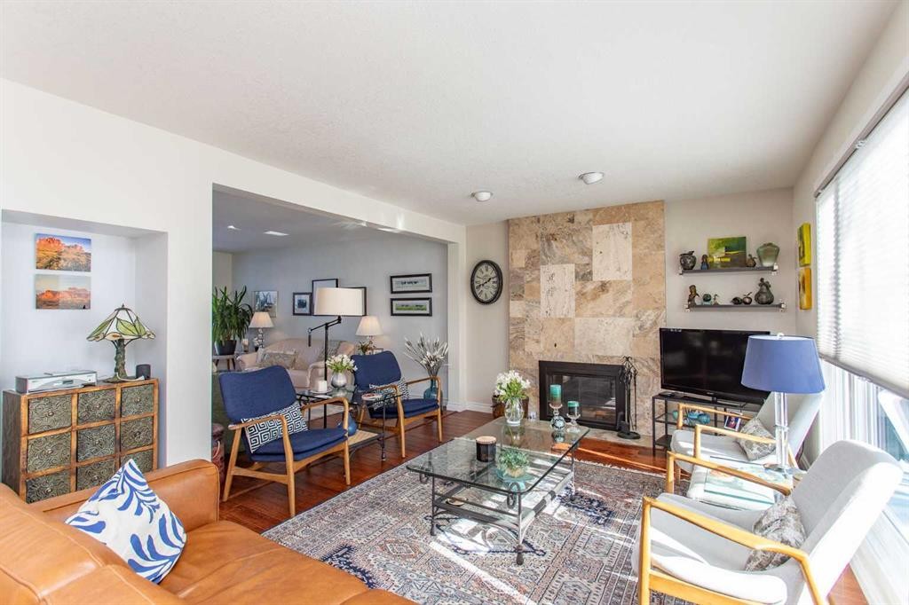 18 Mclevin Crescent, Red Deer, AB - Indoor Photo Showing Living Room With Fireplace