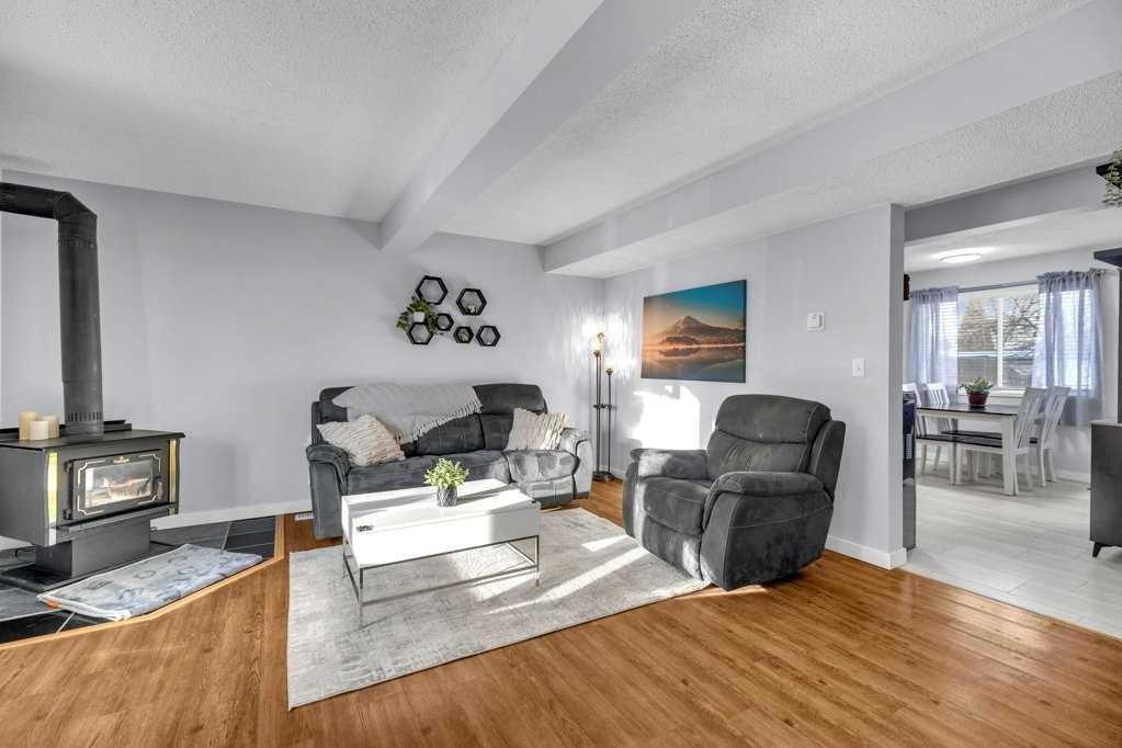 5 Erickson Drive, Red Deer, AB - Indoor Photo Showing Living Room With Fireplace
