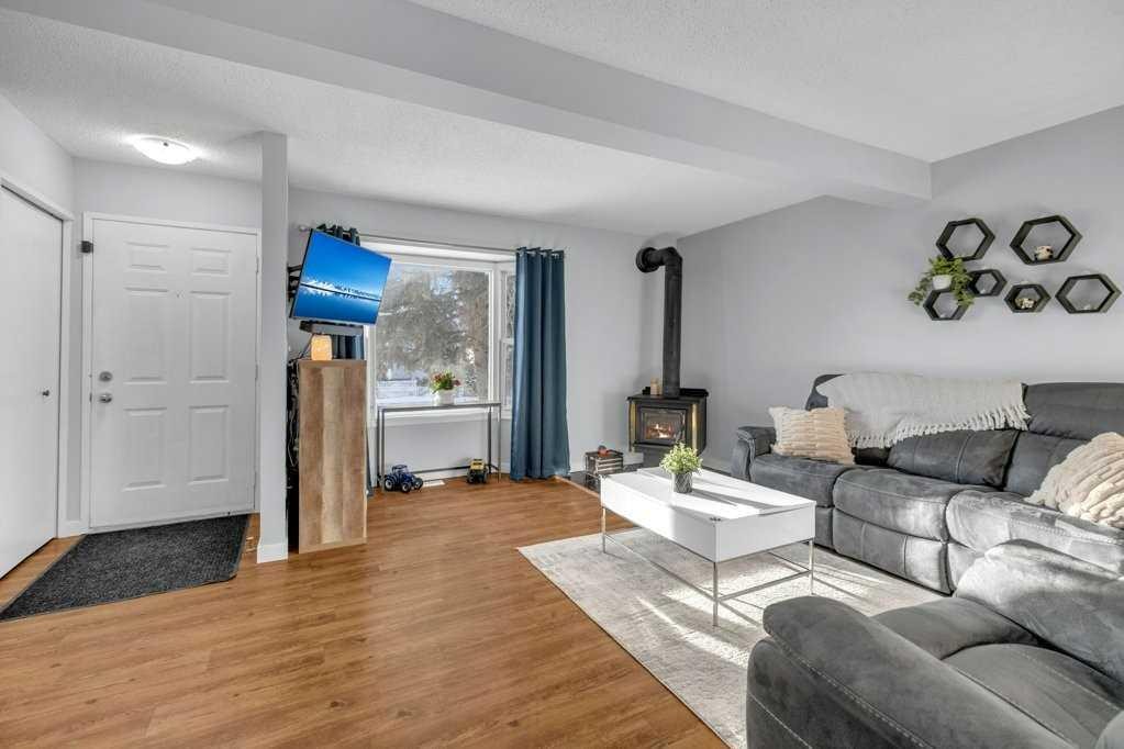 5 Erickson Drive, Red Deer, AB - Indoor Photo Showing Living Room With Fireplace