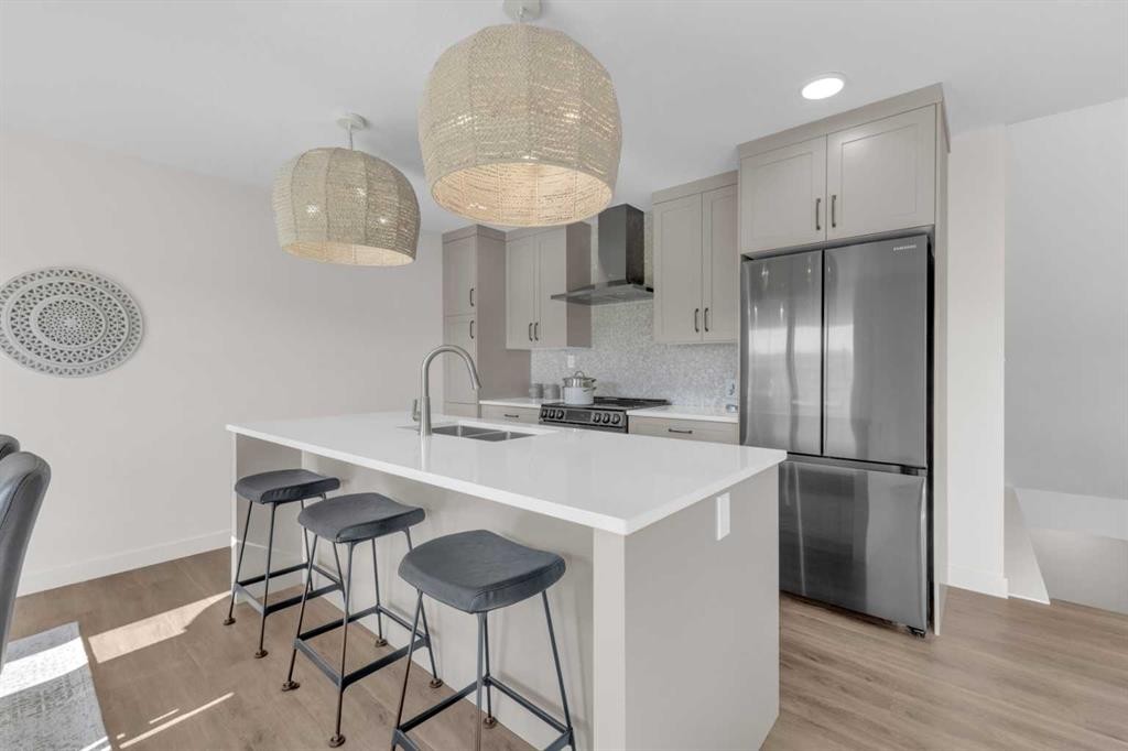 107 Hampton Crescent, Sylvan Lake, AB - Indoor Photo Showing Kitchen With Double Sink With Upgraded Kitchen