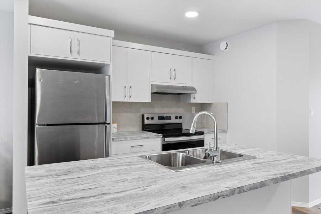 47 Louis Drive, Rural Red Deer County, AB - Indoor Photo Showing Kitchen With Double Sink With Upgraded Kitchen