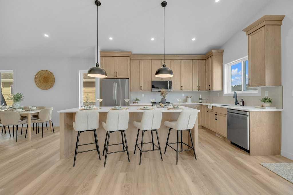 148 Red Ash Cove, Springbrook, AB - Indoor Photo Showing Kitchen With Upgraded Kitchen