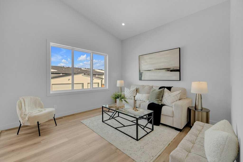 148 Red Ash Cove, Springbrook, AB - Indoor Photo Showing Living Room
