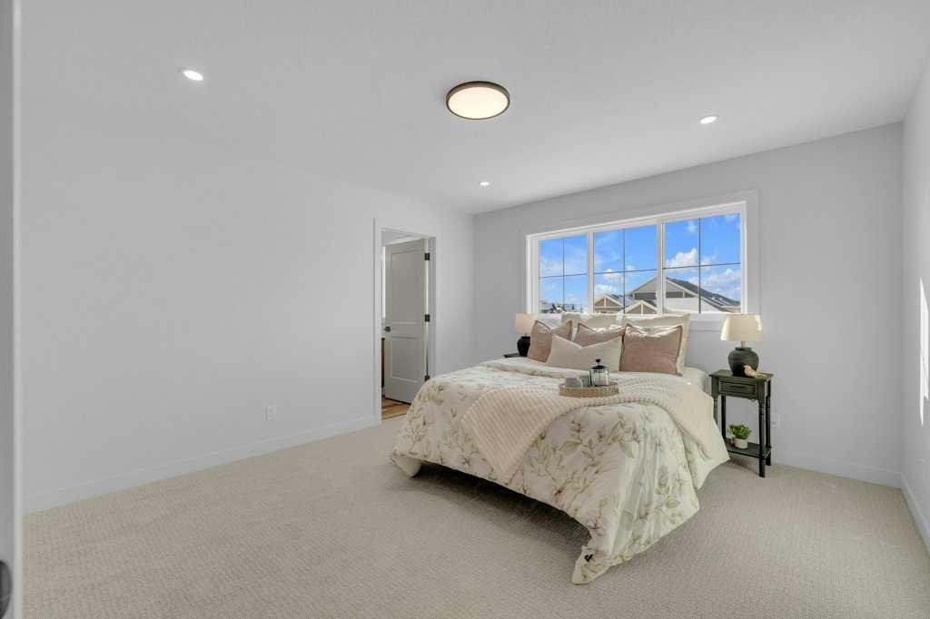 148 Red Ash Cove, Springbrook, AB - Indoor Photo Showing Bedroom