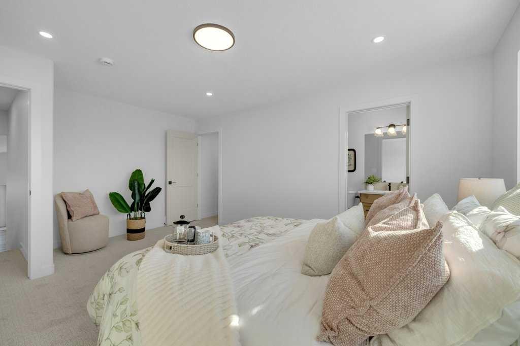 148 Red Ash Cove, Springbrook, AB - Indoor Photo Showing Bedroom