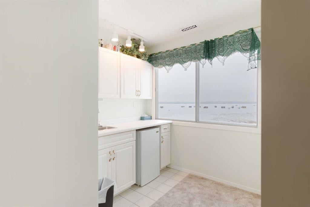 3 Rustic Road, Norglenwold, AB - Indoor Photo Showing Laundry Room