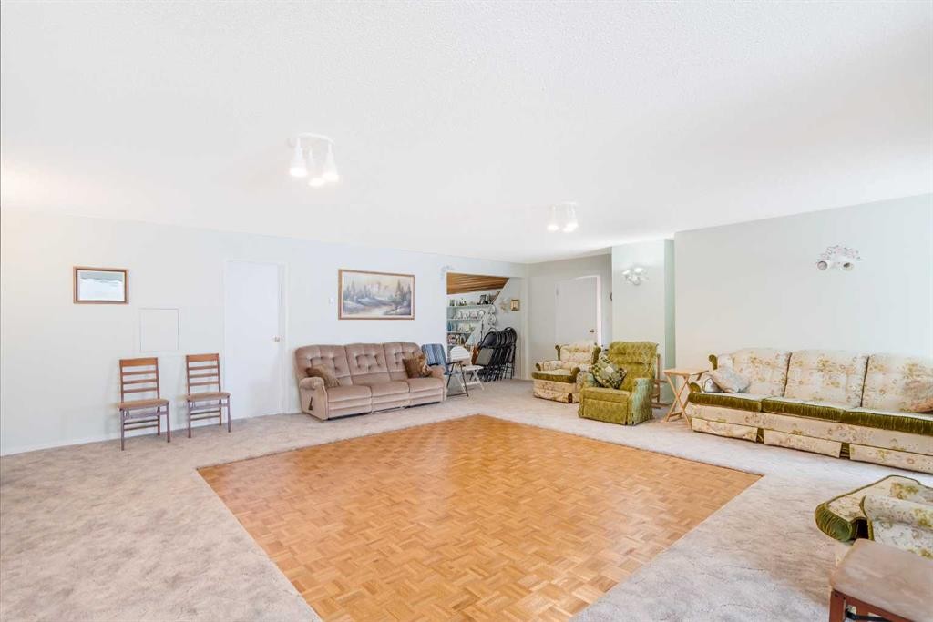 3 Rustic Road, Norglenwold, AB - Indoor Photo Showing Living Room With Fireplace