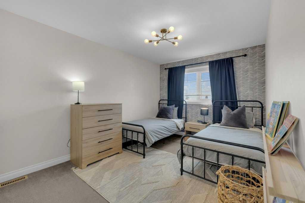 23 Bowman Circle, Sylvan Lake, AB - Indoor Photo Showing Bedroom