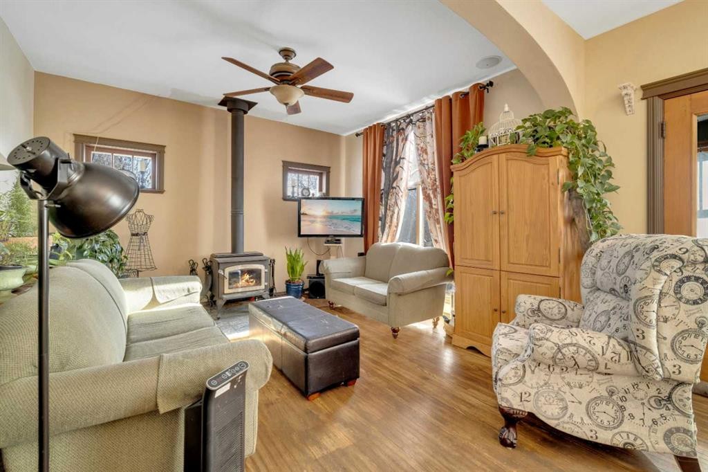 6312 48 Ave, Ponoka, AB - Indoor Photo Showing Living Room With Fireplace