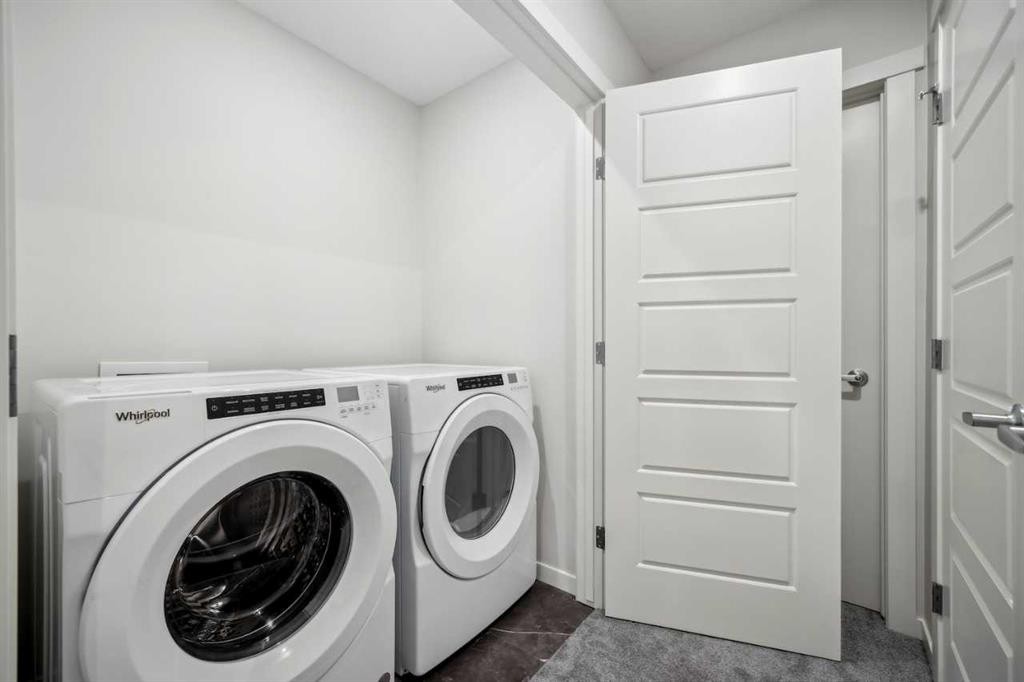 231 Vantage Drive, Cochrane, AB - Indoor Photo Showing Laundry Room