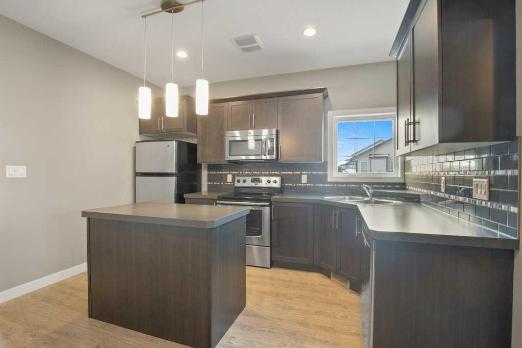 143 Vanier Drive, Red Deer, AB - Indoor Photo Showing Kitchen With Stainless Steel Kitchen With Double Sink