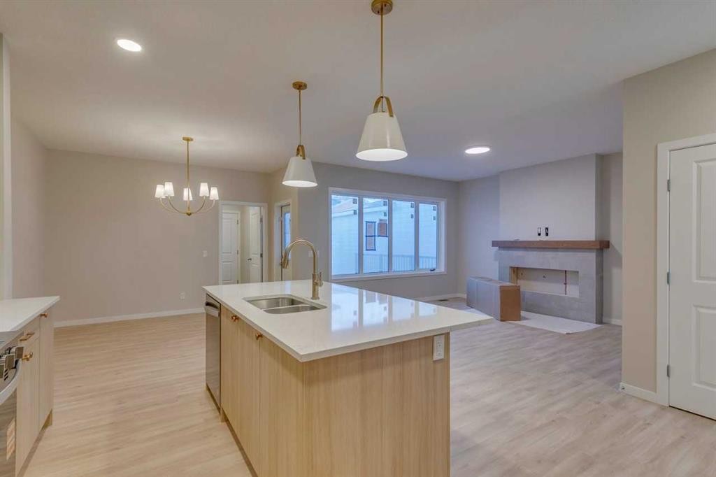 82 Alpine Common Sw, Calgary, AB - Indoor Photo Showing Kitchen With Double Sink