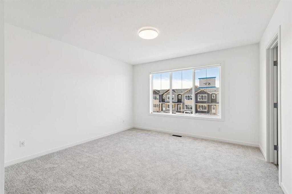 15 Emberside Park, Cochrane, AB - Indoor Photo Showing Other Room