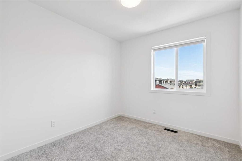 15 Emberside Park, Cochrane, AB - Indoor Photo Showing Other Room