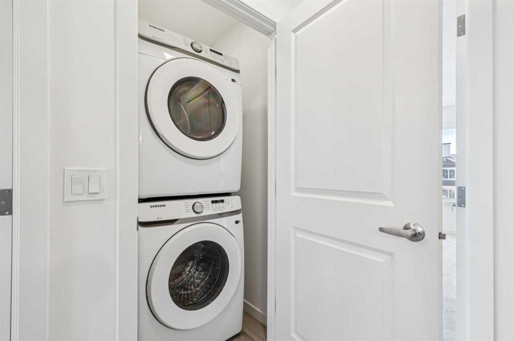 15 Emberside Park, Cochrane, AB - Indoor Photo Showing Laundry Room