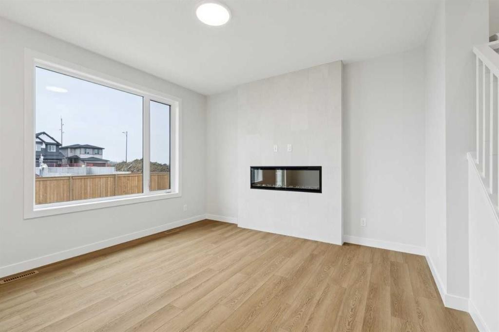85 Southborough Square, Cochrane, AB - Indoor With Fireplace