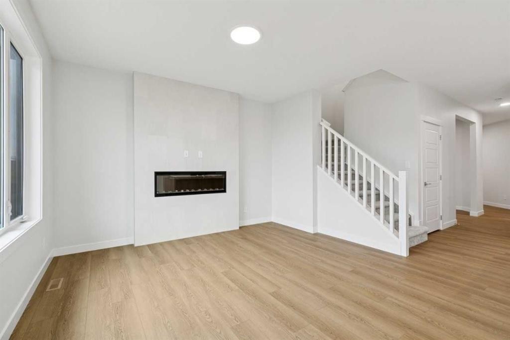 85 Southborough Square, Cochrane, AB - Indoor With Fireplace